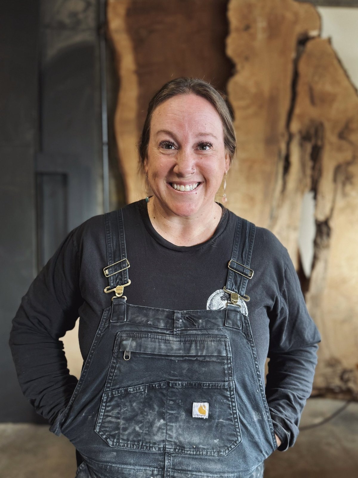 Amy, studio woodworker at Madera Furniture Company, in the Tacoma shop