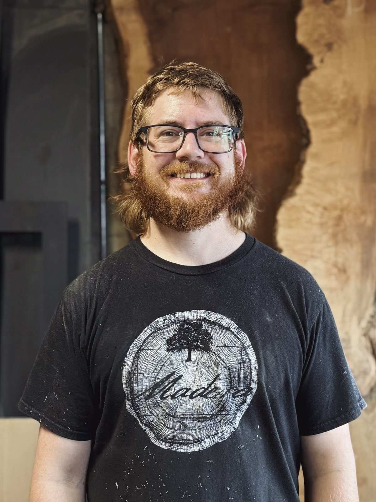 Kevin, studio woodworker at Madera Furniture Company, in the Tacoma shop