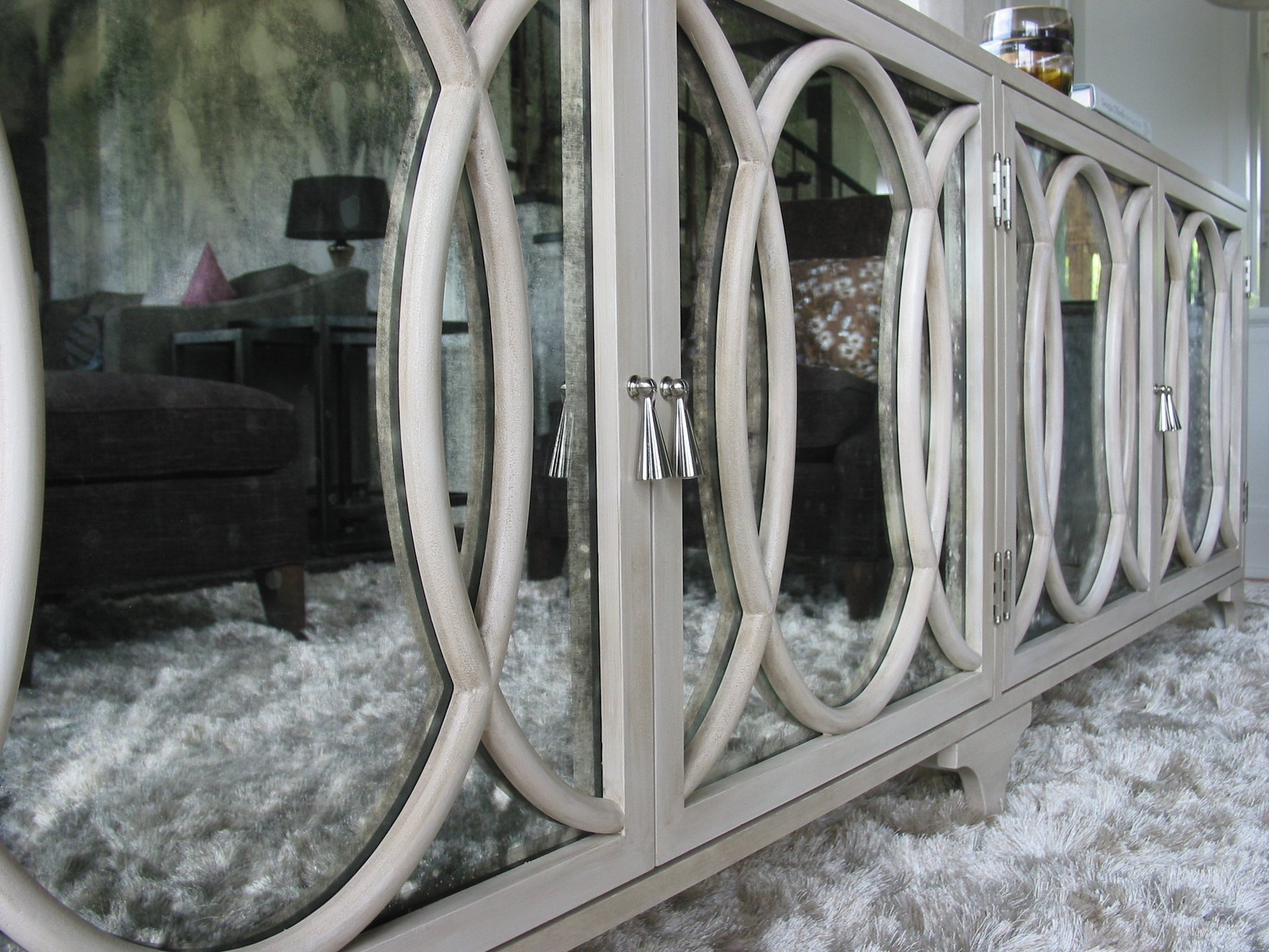 Mirador credenza in whitewashed maple with interlocking circle mullions over antique mirror panels
